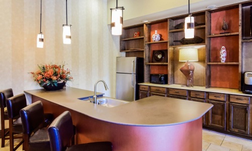 a kitchen with a bar and a table