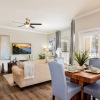 living room with tv couch and dining room table