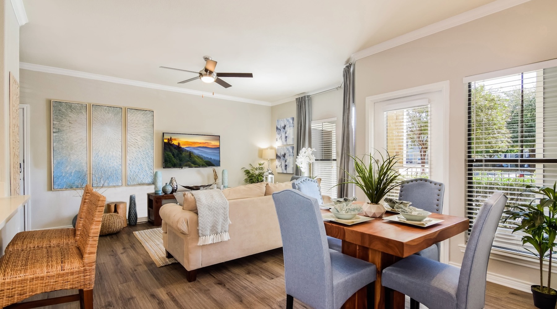Generous living spaces to relax and unwind living room with tv couch and dining room table