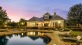 a house with a pool in front