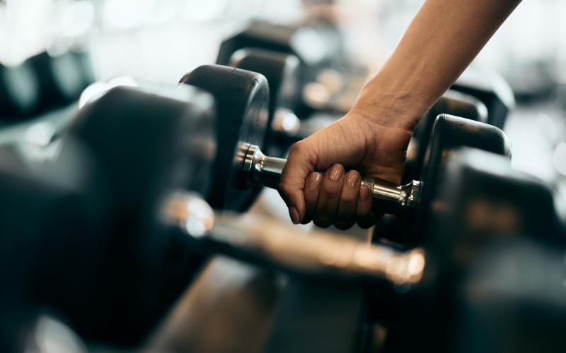 a close-up of a hand holding a dumbbell