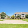 sand volleyball court with a building behind it