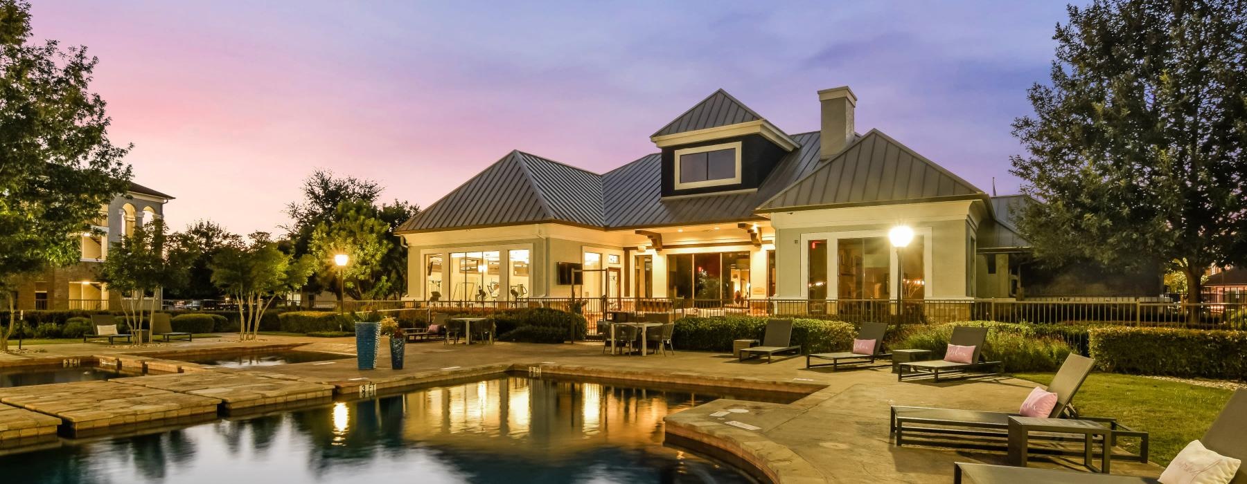a house with a pool in front